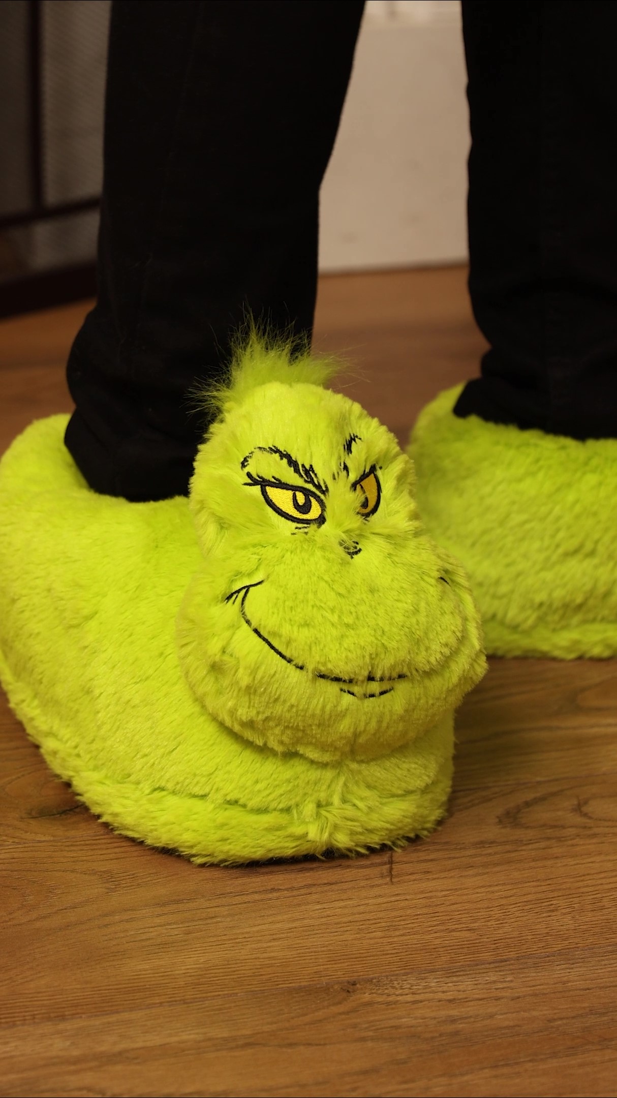 Keep your toes toasty with a hint of holiday mischief in these Adult The Grinch 3D Character Slippers. With their fun design inspired by the Grinch himself, these slippers are perfect for lounging around and adding a playful twist to your holiday season.